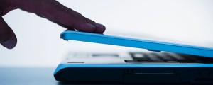 Studio shot of hand closing laptop. Image shot 2011. Exact date unknown.